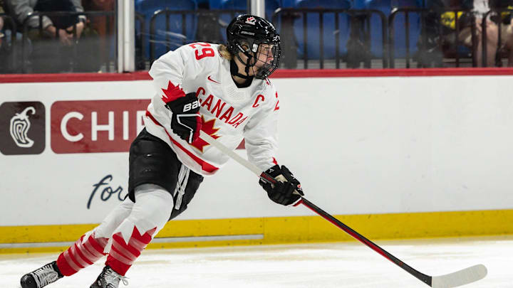 Canada's Marie-Philip Poulin looks for a pass at the Adirondack Bank Center in Utica, N.Y. on April 5, 2024.