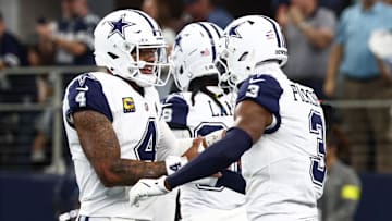 Oct 19, 2025; Arlington, Texas, USA; Dallas Cowboys quarterback Dak Prescott (4) and wide receiver George Pickens (3) ceelbrate after a touchdown against the Washington Commanders during the third quarter of the game at AT&T Stadium. Mandatory Credit: Kevin Jairaj-Imagn Images