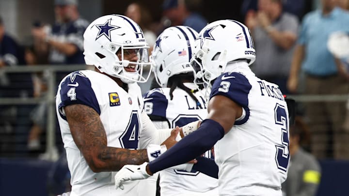 Dallas Cowboys quarterback Dak Prescott and wide receiver George Pickens celebrate after a touchdown against the Washington Commanders during the third quarter of the game at AT&T Stadium. Dallas Cowboys quarterback Dak Prescott and wide receiver George Pickens celebrate after a touchdown against the Washington Commanders during the third quarter of the game at AT&T Stadium.