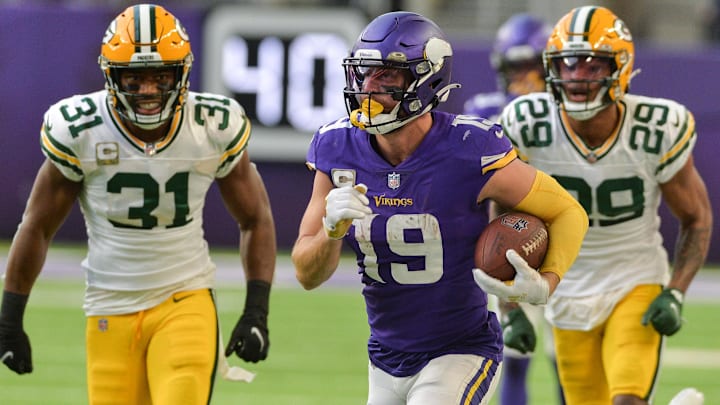 Minnesota Vikings wide receiver Adam Thielen (19) catches a pass late in the game as Green Bay Packers safety Adrian Amos (31) and cornerback Rasul Douglas (29) pursue during the fourth quarter at U.S. Bank Stadium. Minnesota Vikings wide receiver Adam Thielen (19) catches a pass late in the game as Green Bay Packers safety Adrian Amos (31) and cornerback Rasul Douglas (29) pursue during the fourth quarter at U.S. Bank Stadium.