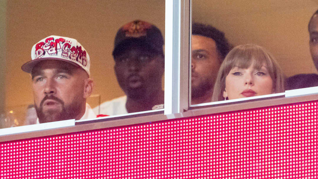 Travis Kelce, Taylor Swift and Jason Kelce watch during the second quarter between the Cincinnati Bearcats and the Nebraska Cornhuskers at GEHA Field at Arrowhead Stadium on Aug. 28.
