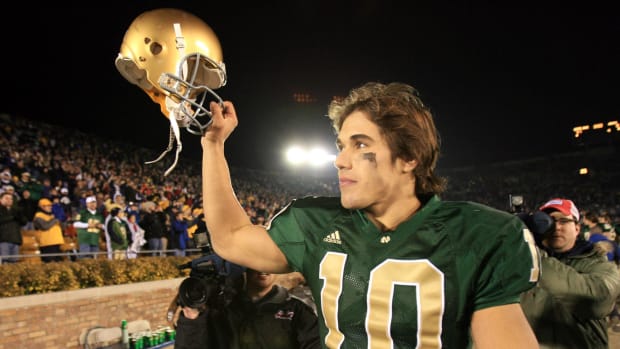 Brady Quinn celebrates after winning his final game as Notre Dame's starting quarterback