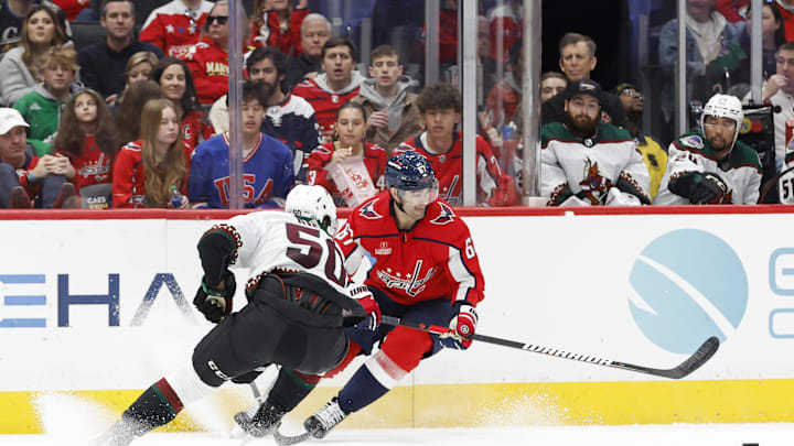 Mar 3, 2024; Washington, District of Columbia, USA; Washington Capitals left wing Max Pacioretty (67) skates with the puck as Arizona Coyotes defenseman Sean Durzi (50) defends in the first period at Capital One Arena. Mandatory Credit: Geoff Burke-Imagn Images