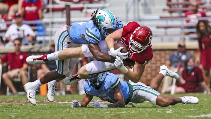 Sep 4, 2021; Norman, Oklahoma, USA;  Oklahoma Sooners tight end Austin Stogner (18) is tackled by Tulane Green Wave linebacker Dorian Williams (2) during the fourth quarter at Gaylord Family-Oklahoma Memorial Stadium.