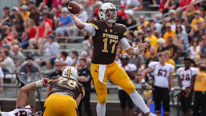 Wyoming Cowboys QB Josh Allen looks to pass against Gardner-Webb Bulldogs. Wyoming Cowboys QB Josh Allen looks to pass against Gardner-Webb Bulldogs.