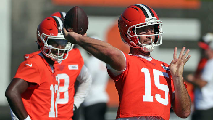 Cleveland Browns quarterback Joe Flacco (15) throws as quarterback Shedeur Sanders (12) looks on during a training camp practice July 23, 2025, in Berea, Ohio.