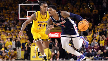 Arizona's Caleb Love drives past Arizona State's Adam Miller during the Wildcats' 81-72 victory over the Sun Devils in Tempe, Arizona, on Saturday, Feb. 1, 2024.