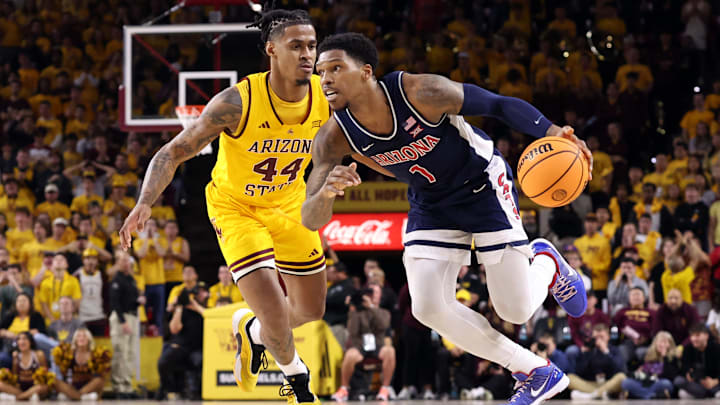 Arizona's Caleb Love drives past Arizona State's Adam Miller during the Wildcats' 81-72 victory over the Sun Devils in Tempe, Arizona, on Saturday, Feb. 1, 2024.