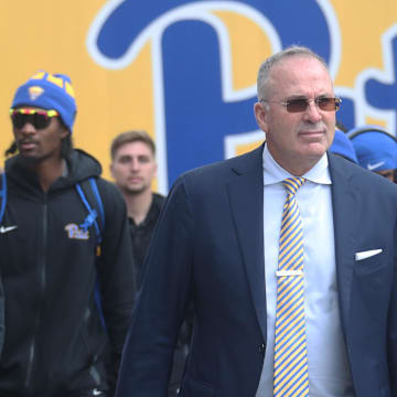 Oct 25, 2025; Pittsburgh, Pennsylvania, USA; Pittsburgh Panthers head coach Pat Narduzzi (middle) leads the Panthers to the stadium to play the North Carolina State Wolfpack at Acrisure Stadium. Mandatory Credit: Charles LeClaire-Imagn Images