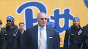 Oct 25, 2025; Pittsburgh, Pennsylvania, USA; Pittsburgh Panthers head coach Pat Narduzzi (middle) leads the Panthers to the stadium to play the North Carolina State Wolfpack at Acrisure Stadium. Mandatory Credit: Charles LeClaire-Imagn Images