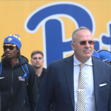 Oct 25, 2025; Pittsburgh, Pennsylvania, USA; Pittsburgh Panthers head coach Pat Narduzzi (middle) leads the Panthers to the stadium to play the North Carolina State Wolfpack at Acrisure Stadium. Mandatory Credit: Charles LeClaire-Imagn Images