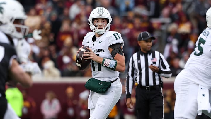 Nov 1, 2025; Minneapolis, Minnesota, USA; Michigan State Spartans quarterback Alessio Milivojevic (11) looks to pass against the Minnesota Golden Gophers during the first half at Huntington Bank Stadium. Mandatory Credit: Matt Krohn-Imagn Images