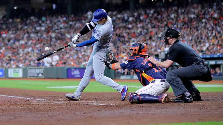 Jul 28, 2024; Houston, Texas, USA; Los Angeles Dodgers designated hitter Shohei Ohtani (17) hits a fly ball for an out against the Houston Astros during the fifth inning at Minute Maid Park. Mandatory Credit: Erik Williams-USA TODAY Sports