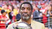 Feb 12, 2023; Glendale, Arizona, US; Doug Williams holds the Vince Lombardi trophy before Super Bowl LVII between the Kansas City Chiefs and the Philadelphia Eagles at State Farm Stadium. Mandatory Credit: Mark J. Rebilas-USA TODAY Sports