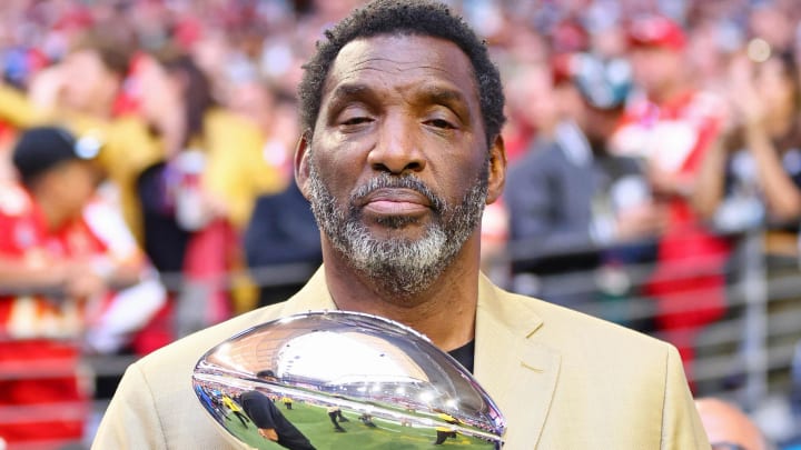 Feb 12, 2023; Glendale, Arizona, US; Doug Williams holds the Vince Lombardi trophy before Super Bowl LVII between the Kansas City Chiefs and the Philadelphia Eagles at State Farm Stadium. Mandatory Credit: Mark J. Rebilas-USA TODAY Sports