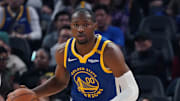 Jan 4, 2025; San Francisco, California, USA;  Golden State Warriors forward Jonathan Kuminga (00) dribbles up court in front of Memphis Grizzlies guard Scotty Pippen Jr. (1) in the second quarter at Chase Center. Mandatory Credit: David Gonzales-Imagn Images