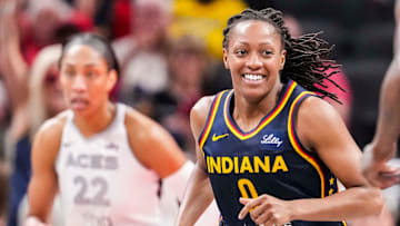 Indiana Fever guard Kelsey Mitchell (0) smiles after a play Thursday, July 3, 2025, during a game between the Indiana Fever and the Las Vegas Aces at Gainbridge Fieldhouse in Indianapolis.