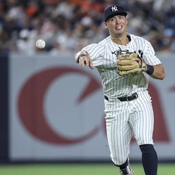 Jul 30, 2025; Bronx, New York, USA;  New York Yankees shortstop Anthony Volpe (11) makes a throwing error in the eighth inning against the Tampa Bay Rays at Yankee Stadium. Mandatory Credit: Wendell Cruz-Imagn Images