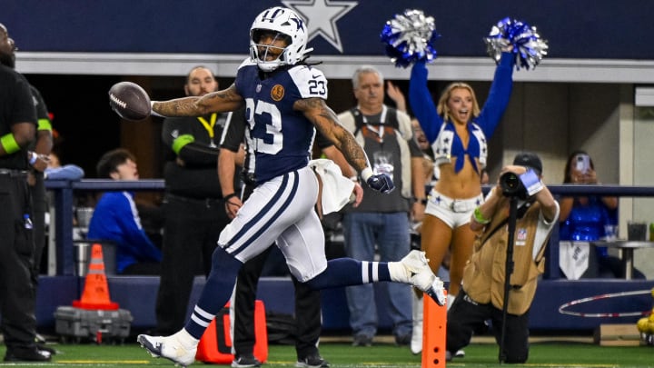 Nov 23, 2023; Arlington, Texas, USA; Dallas Cowboys running back Rico Dowdle (23) scores a touchdown  against the Washington Commanders during the first quarter at AT&T Stadium. Mandatory Credit: Jerome Miron-USA TODAY Sports