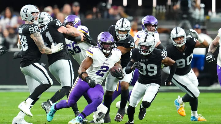 Dec 10, 2023; Paradise, Nevada, USA; Minnesota Vikings running back Alexander Mattison (2) gains yardage against the Las Vegas Raiders during the second quarter at Allegiant Stadium. Mandatory Credit: Stephen R. Sylvanie-USA TODAY Sports