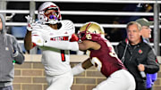 Oct 25, 2024; Chestnut Hill, Massachusetts, USA; Louisville Cardinals wide receiver Ja'Corey Brooks (1) makes a catch while being defended by Boston College Eagles defensive back Ashton McShane (35) during the second half at Alumni Stadium. Mandatory Credit: Eric Canha-Imagn Images