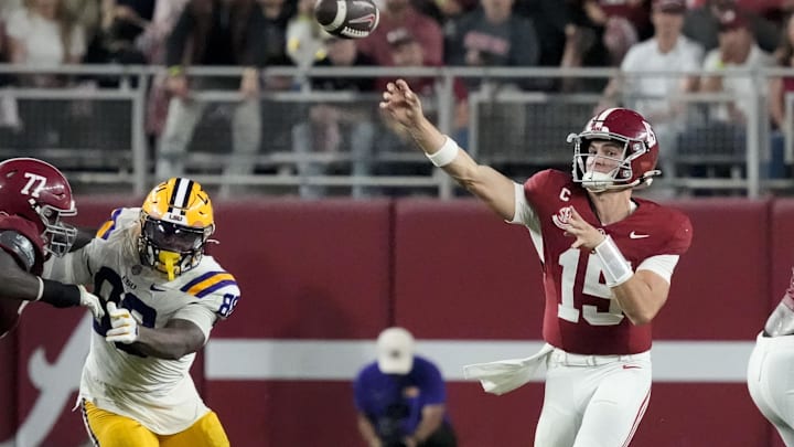 Nov 8, 2025; Tuscaloosa, Alabama, USA;  Alabama quarterback Ty Simpson (15) throws as he is pressured by LSU defensive lineman Bernard Gooden (88) at Saban Field at Bryant-Denny Stadium. Mandatory Credit: Gary Cosby Jr.-Imagn Images