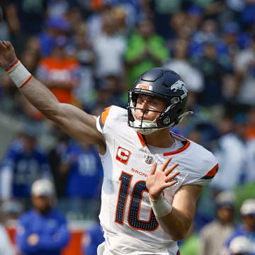 Sep 8, 2024; Seattle, Washington, USA; Denver Broncos quarterback Bo Nix (10) passes against the Seattle Seahawks during the second quarter at Lumen Field. 