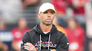 Oct 5, 2025; Glendale, Arizona, USA; Arizona Cardinals head coach Jonathan Gannon stands on the field before their game against the Tennessee Titans at State Farm Stadium. Mandatory Credit: Joe Camporeale-Imagn Images