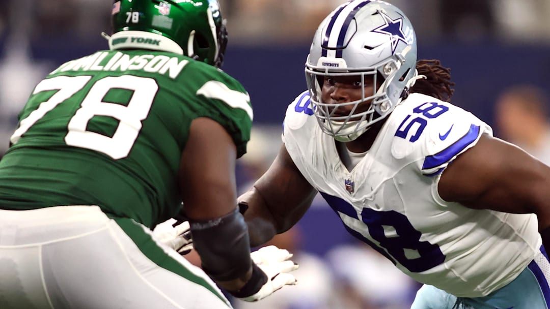 Sep 17, 2023; Arlington, Texas, USA; Dallas Cowboys defensive tackle Mazi Smith (58) rushes the passer while blocked by New York Jets guard Laken Tomlinson (78) in the third quarter at AT&T Stadium.