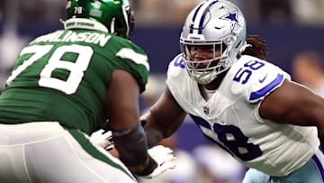 Sep 17, 2023; Arlington, Texas, USA; Dallas Cowboys defensive tackle Mazi Smith (58) rushes the passer while blocked by New York Jets guard Laken Tomlinson (78) in the third quarter at AT&T Stadium.