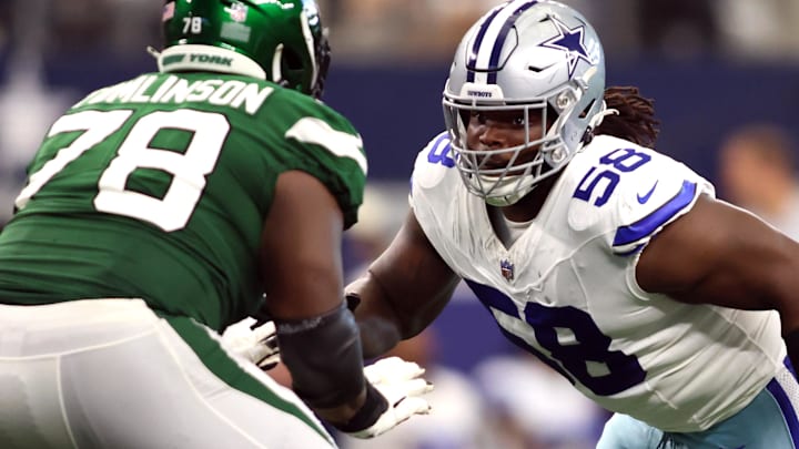 Sep 17, 2023; Arlington, Texas, USA; Dallas Cowboys defensive tackle Mazi Smith (58) rushes the passer while blocked by New York Jets guard Laken Tomlinson (78) in the third quarter at AT&T Stadium.