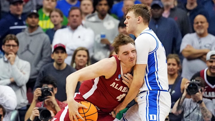Mar 29, 2025; Newark, NJ, USA; Alabama Crimson Tide forward Grant Nelson (4) drives to the basket against Duke basketball forward Cooper Flagg (2) during the second half in the East Regional final of the 2025 NCAA tournament at Prudential Center.