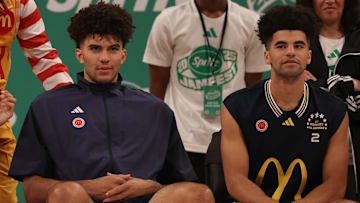 Mar 31, 2025; Brooklyn, New York, USA; McDonald’s All Americans East forward Cameron Boozer (12), left, and East guard Cayden Boozer (2), right, sit on the court during the Sprite Jam Fest at Barclay's Center.
