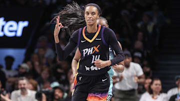 Jul 25, 2025; Brooklyn, New York, USA;  Phoenix Mercury forward DeWanna Bonner (14) gestures after making a three-point shot in the second quarter against the New York Liberty at Barclays Center. Mandatory Credit: Wendell Cruz-Imagn Images