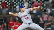 Aug 22, 2025; Cumberland, Georgia, USA; New York Mets pitcher Ryan Helsley (56) pitches the ball against the Atlanta Braves during the ninth inning at Truist Park. 