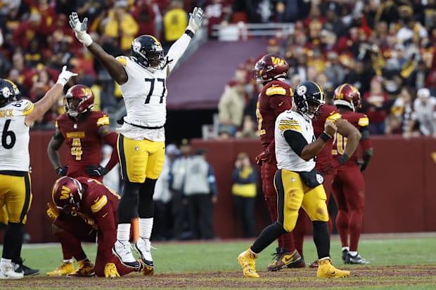 Football players celebrate a touchdow