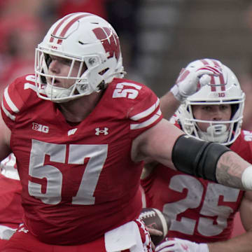 Wisconsin offensive lineman Jake Renfro (57) provides pas protection during the fourth quarter of their game against Ohio State Saturday, October 18, 2025 at Camp Randall Stadium in Madison, Wisconsin.