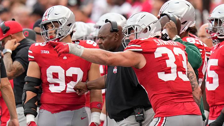 Aug 31, 2024; Columbus, OH, USA; Ohio State Buckeyes defensive end Jack Sawyer (33) points out a play to coach Larry Johnson during the second half of the NCAA football game against the Akron Zips at Ohio Stadium. Ohio State won 52-6.