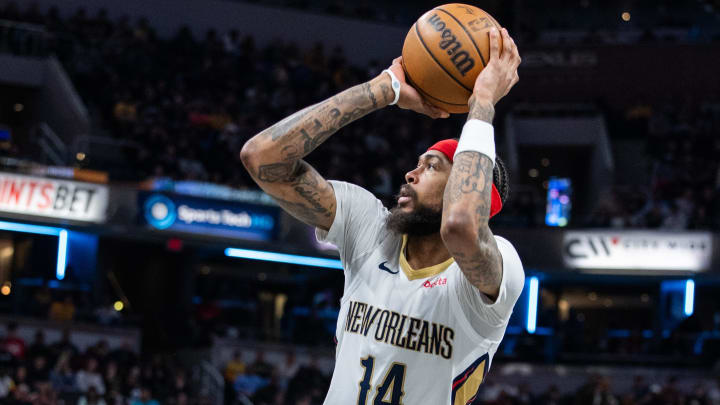 Feb 28, 2024; Indianapolis, Indiana, USA; New Orleans Pelicans forward Brandon Ingram (14) shoots the ball in the first half against the Indiana Pacers at Gainbridge Fieldhouse.