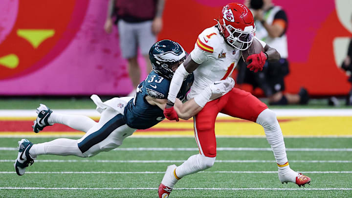 Kansas City Chiefs wide receiver Xavier Worthy (1) runs with the ball against Philadelphia Eagles cornerback Cooper DeJean (33) during the first half of Super Bowl LIX at Caesars Superdome.