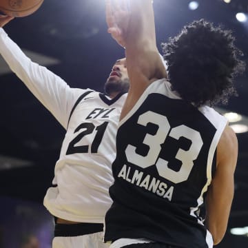 Feb 18, 2024; Indianapolis, Indiana, USA; Team ELY guard Trevelin Queen (21) of the Osceola Magic shoots the ball defended by Team BallIsLife forward Izan Almansa (33) G League Ignite during the G-League Next Up game at Indiana Convention Center. Mandatory Credit: Trevor Ruszkowski-USA TODAY Sports