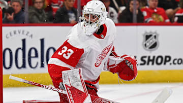 Oct 1, 2022; Chicago, Illinois, USA;  Detroit Red Wings goaltender Sebastian Cossa (33) defends the net against the Chicago Blackhawks at United Center. Mandatory Credit: Jamie Sabau-Imagn Images