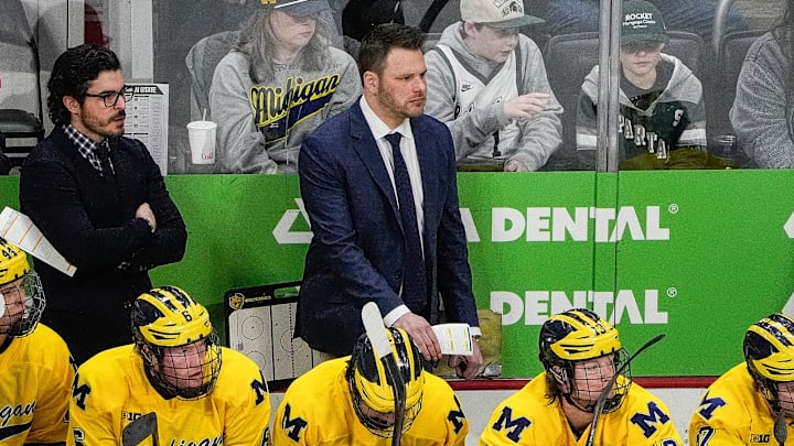 Michigan head coach Brandon Naurato watches a play against Michigan State during the first period of Duel in the D at Little Caesars Arena in Detroit on Saturday, Feb. 8, 2025.