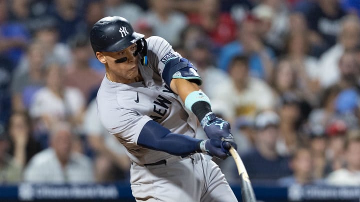 New York Yankees outfielder Aaron Judge (99) hits a single during the eleventh inning against the Philadelphia Phillies at Citizens Bank Park. 