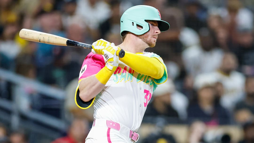 Sep 26, 2025; San Diego, California, USA; San Diego Padres designated hitter Ryan O'Hearn (32) hits a rbi single during the fourth inning Arizona Diamondbacks at Petco Park. Mandatory Credit: David Frerker-Imagn Images