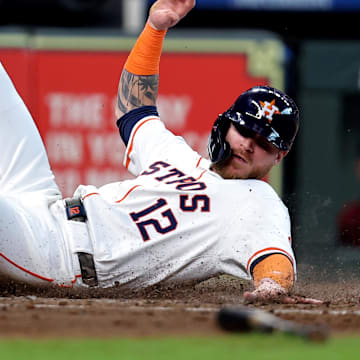 Houston Astros right fielder Ben Gamel slides across home plate during a game against the Arizona Diamondbacks on Sept. 7 at Minute Maid Park.