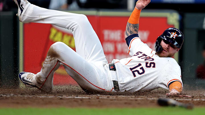 Houston Astros right fielder Ben Gamel slides across home plate during a game against the Arizona Diamondbacks on Sept. 7 at Minute Maid Park.