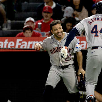 Sep 14, 2024; Anaheim, California, USA; Houston Astros outfielder Yordan Alvarez (44) celebrates with second baseman Jose Altuve (27) after hitting a two-run home run during the 5th inning against the Los Angeles Angels at Angel Stadium.