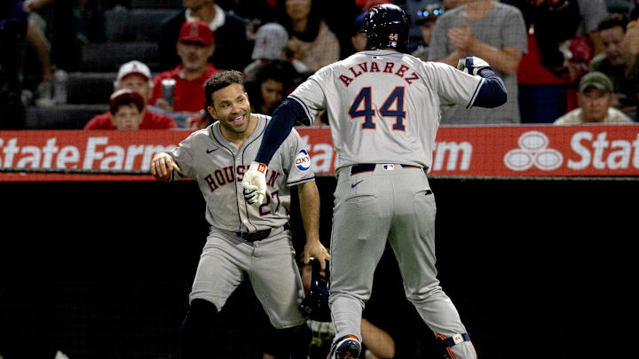 Sep 14, 2024; Anaheim, California, USA; Houston Astros outfielder Yordan Alvarez (44) celebrates with second baseman Jose Altuve (27) after hitting a two-run home run during the 5th inning against the Los Angeles Angels at Angel Stadium.