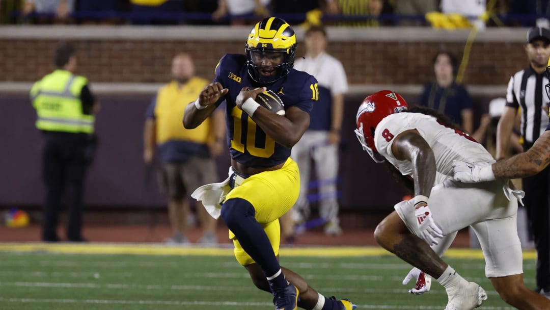 Aug 31, 2024; Ann Arbor, Michigan, USA;  Michigan Wolverines quarterback Alex Orji (10) rushes in the second half against the Fresno State Bulldogs at Michigan Stadium. Mandatory Credit: Rick Osentoski-USA TODAY Sports